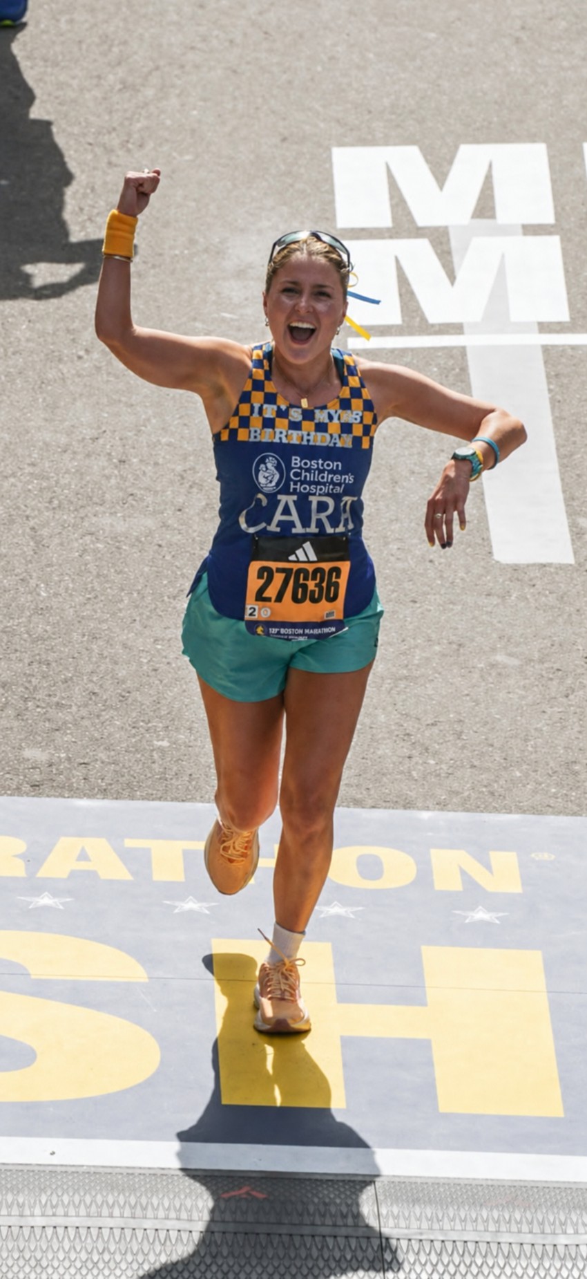 Cara Crasco celebrating during the Boston Marathon